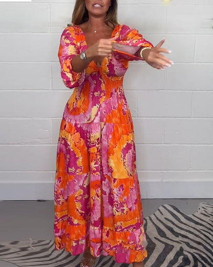 NOVERA™ | Diepe V kleurrijke lange jurk